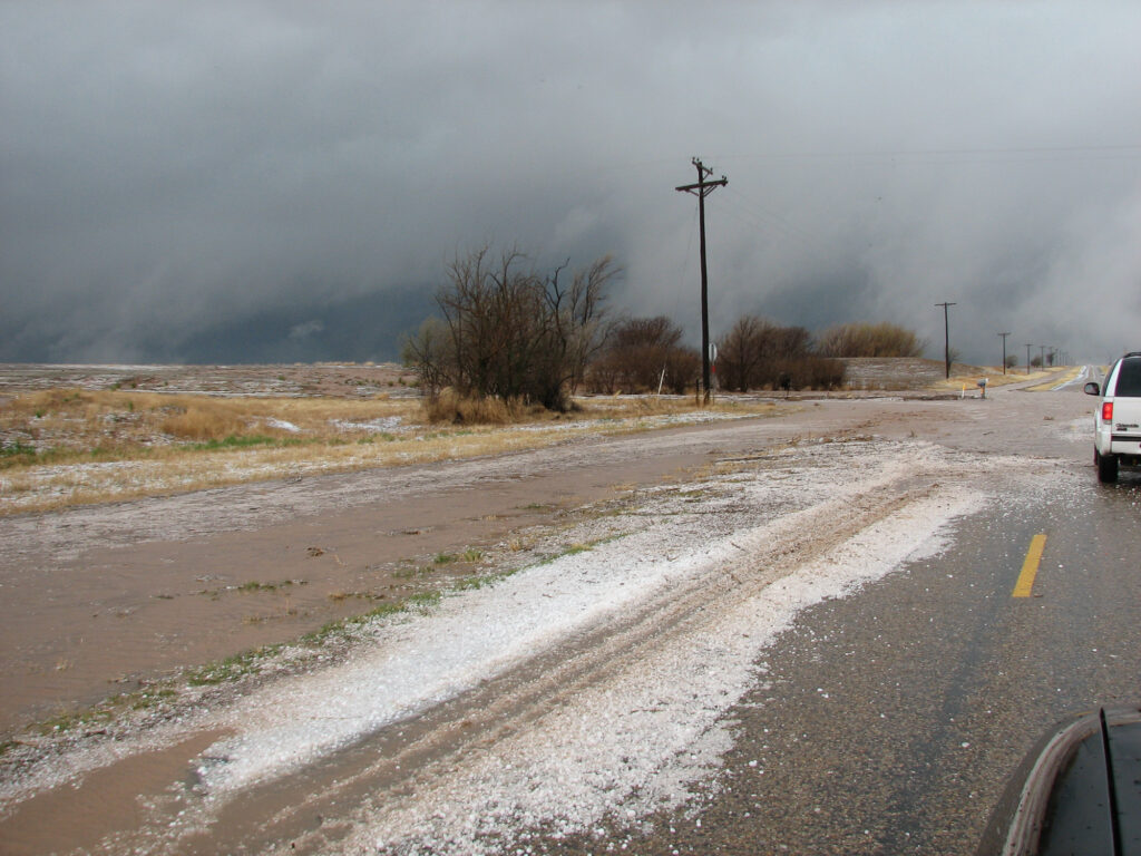 Hail covering the road near Tulia