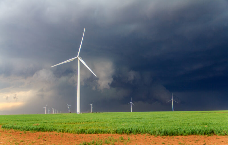 Wall Cloud behind windmills